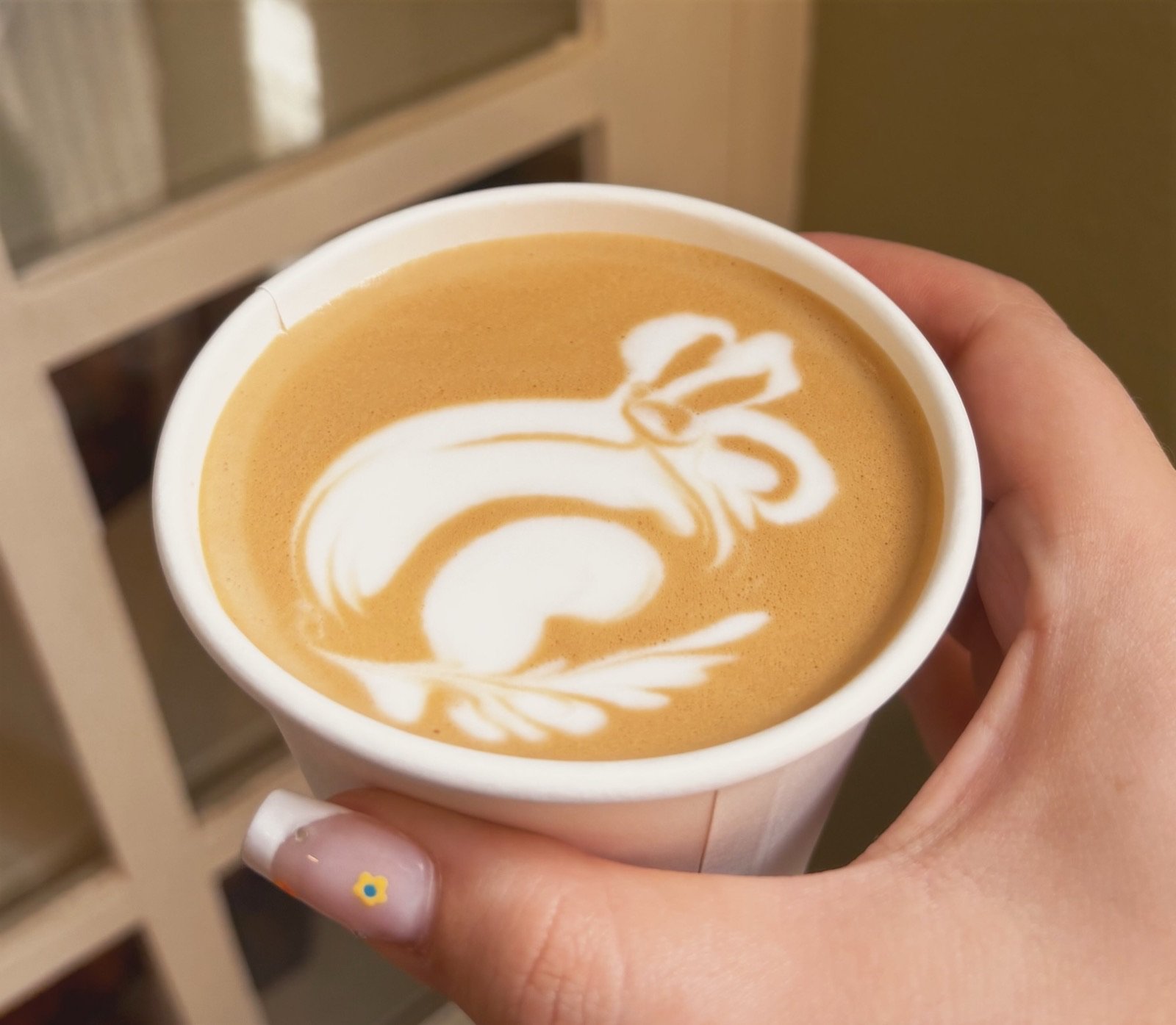 Latte with bow-shaped latte art